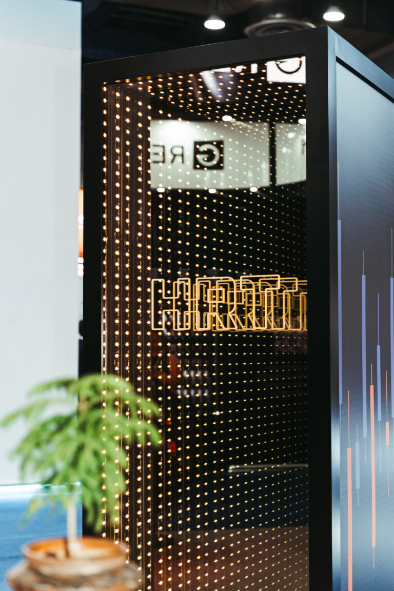 Illuminated HRT branding and event decor photographed at a corporate venue in Korea