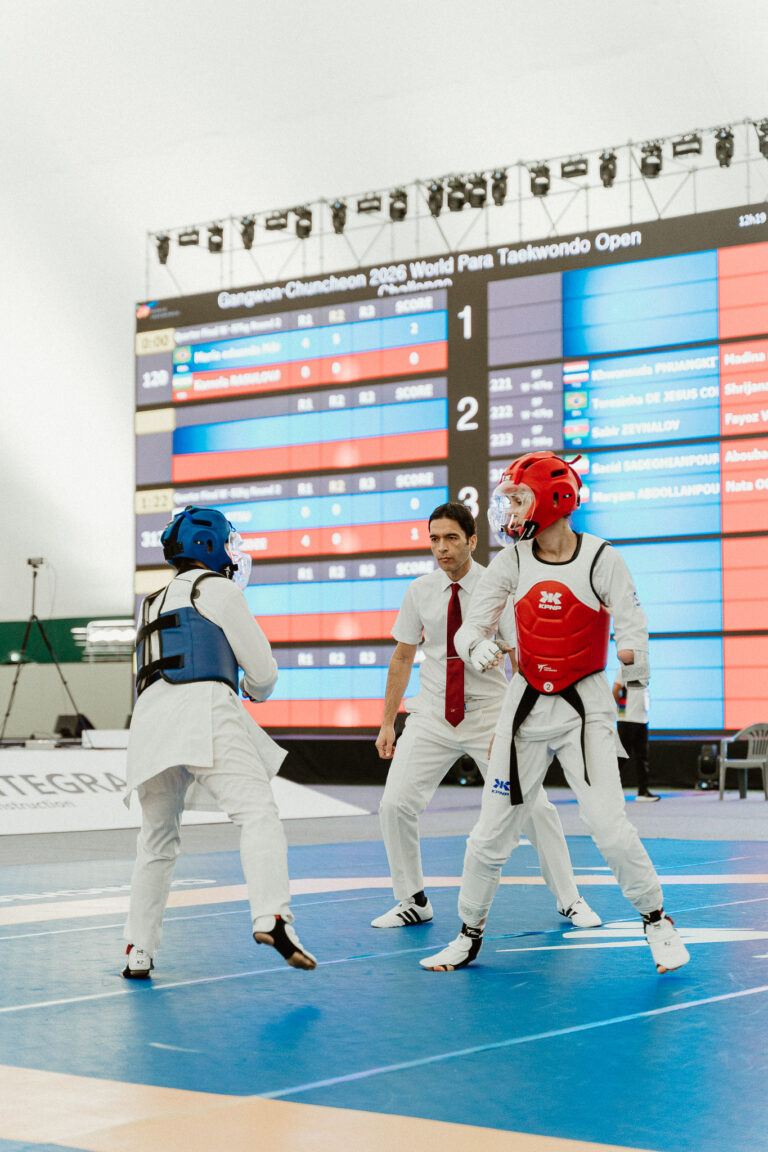 Taekwondo athletes competing during a professional sporting event in South Korea