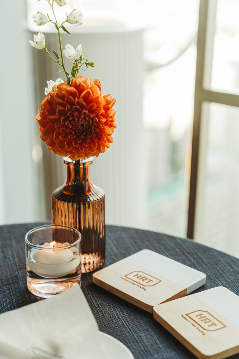 Floral centerpiece and branded materials photographed at a corporate event in Korea