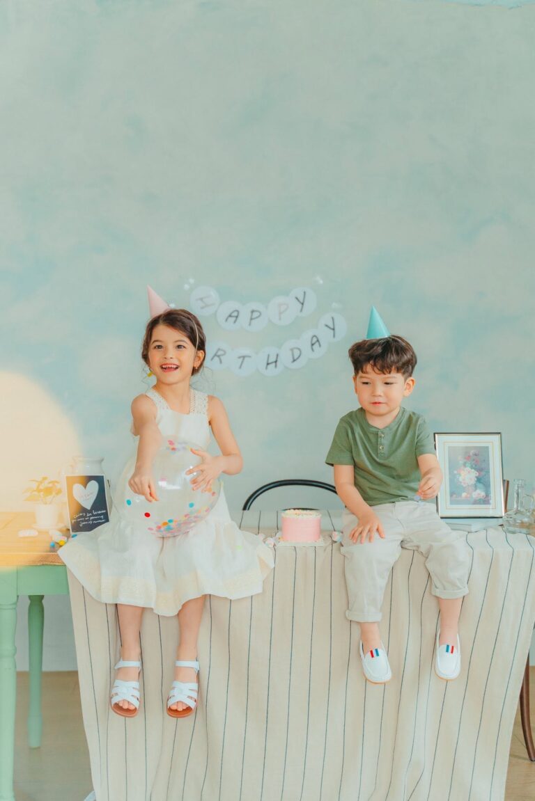 Two children posing together during a birthday photoshoot in Seoul