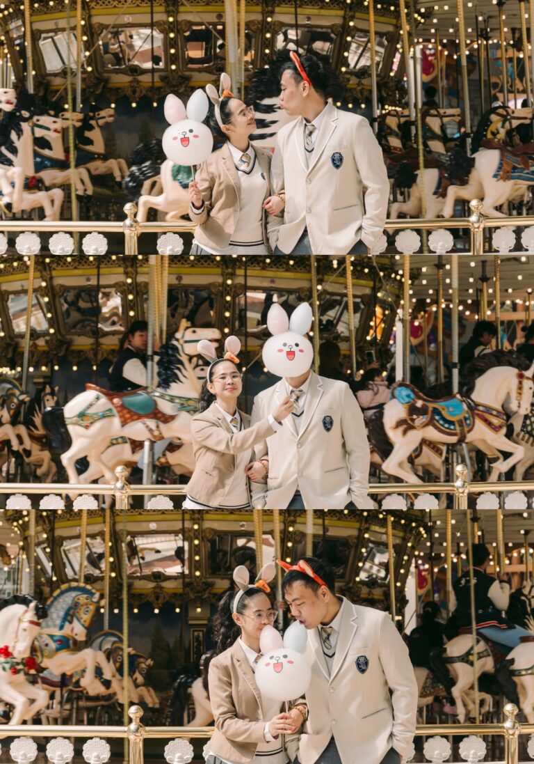 Couple posing by a carousel during a Lotte World photoshoot