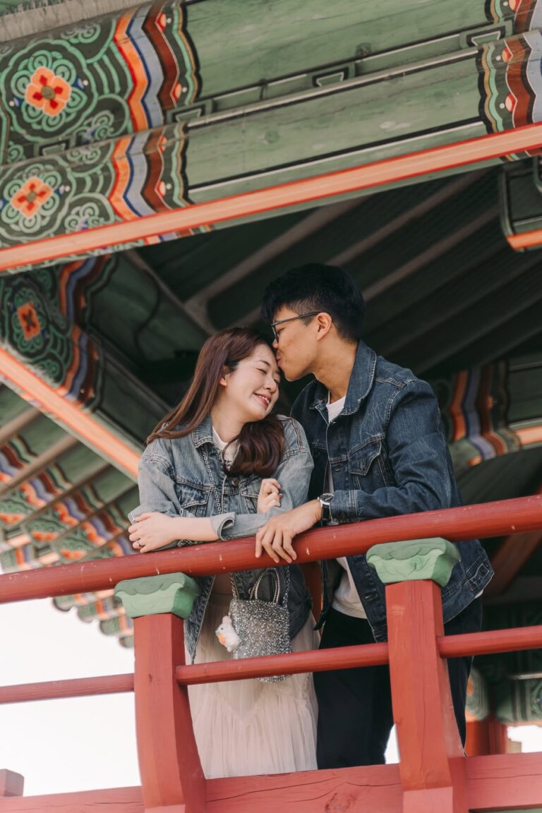 Couple sharing a candid moment at a traditional Korean palace in Seoul