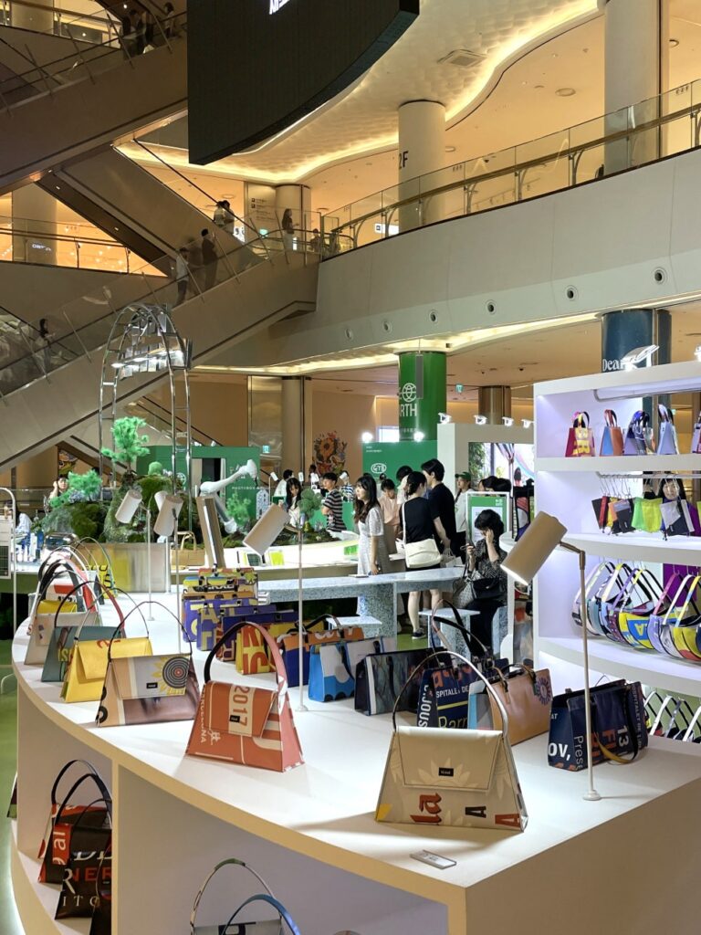 Wide view of exhibition booths and product displays during a corporate event in Korea