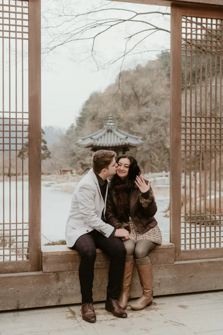 Couple sitting together during a winter photography session in Seoul