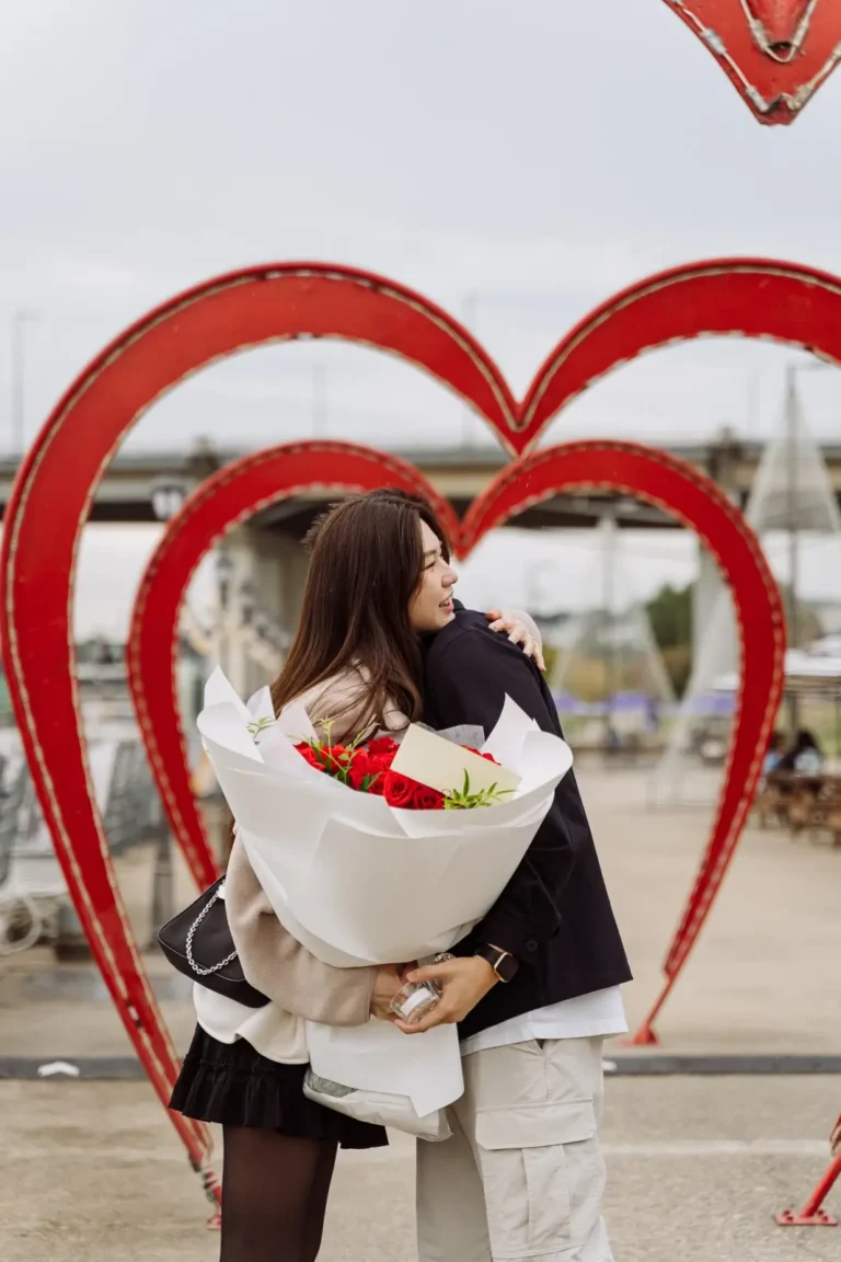 Newly engaged woman holding flowers after a romantic proposal in Seoul