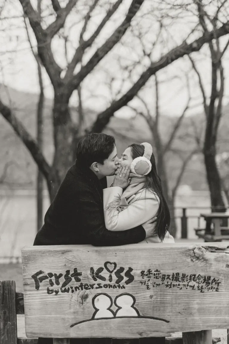Black and white portrait of a couple kissing during a winter nami island photoshoot