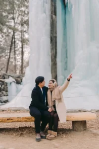 Couple enjoying a snowy winter location during their Seoul engagement session