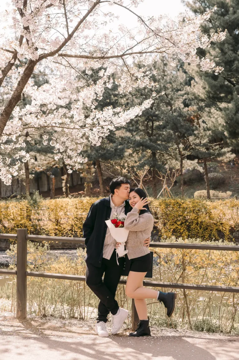 Engaged couple posing together during a romantic outdoor Seoul photography session