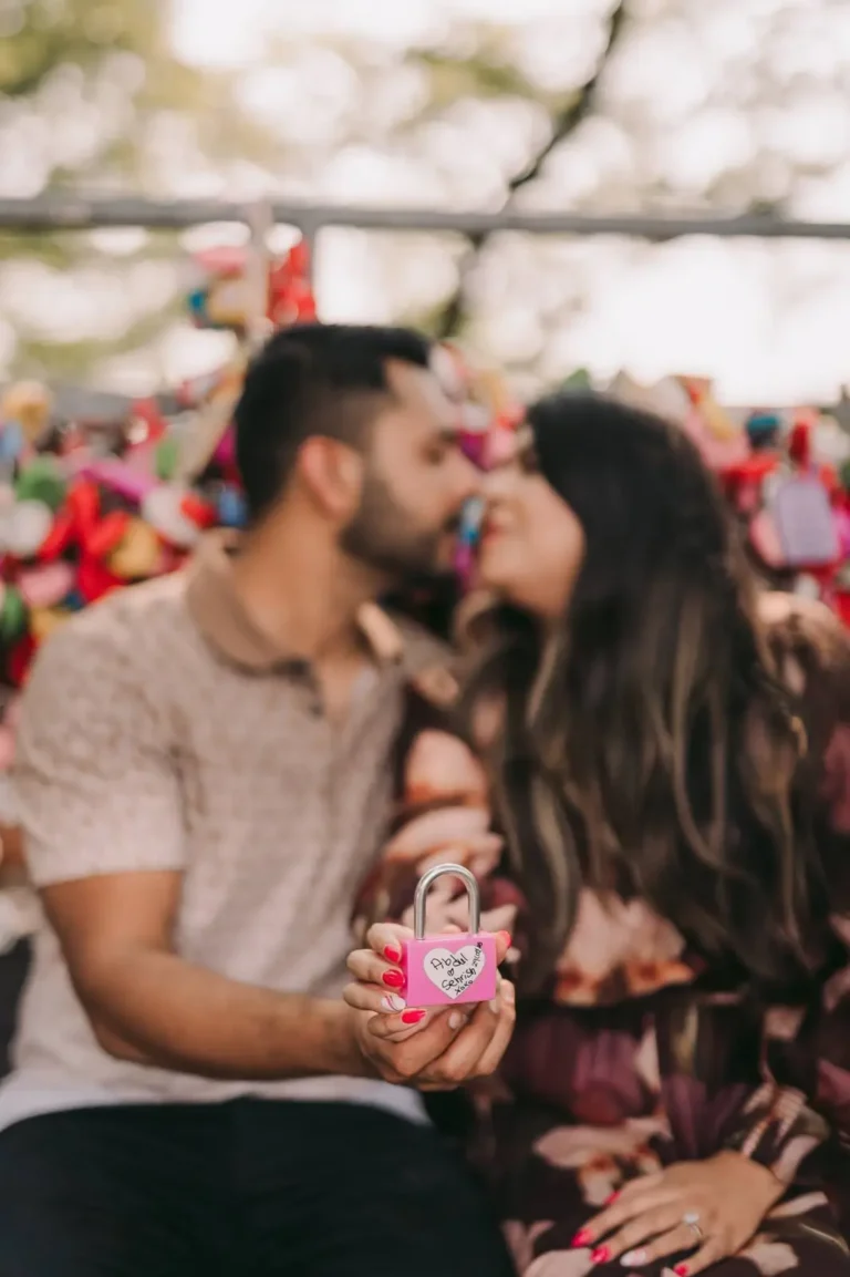 Couple kissing beside colorful love locks during a romantic Seoul photoshoot