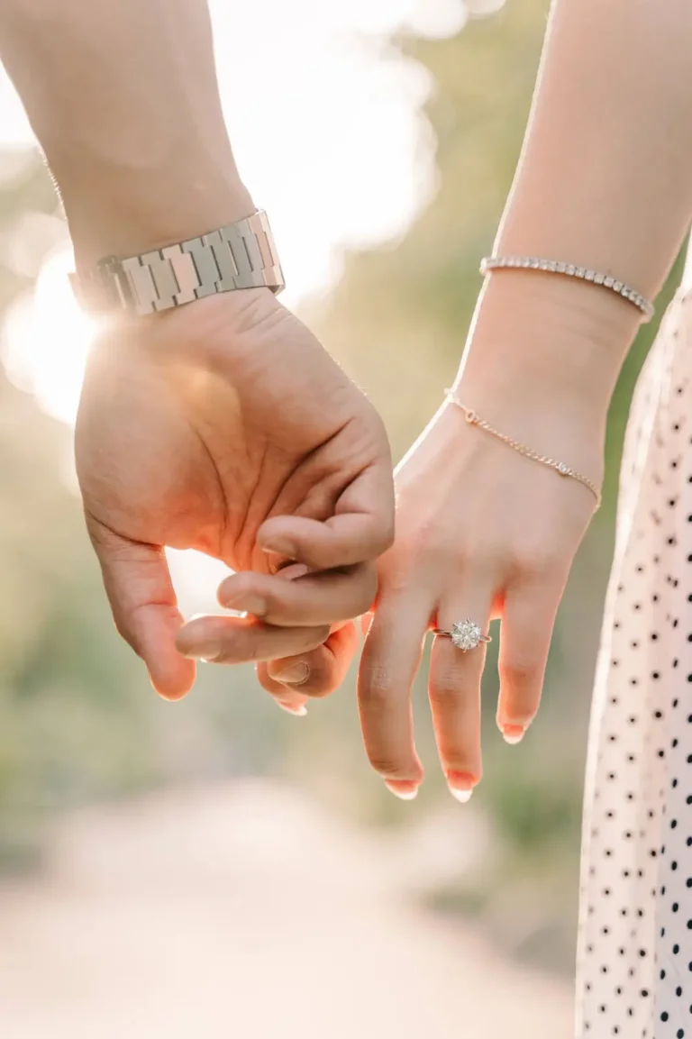 Close-up of an engaged couple holding hands and showing their ring in Seoul