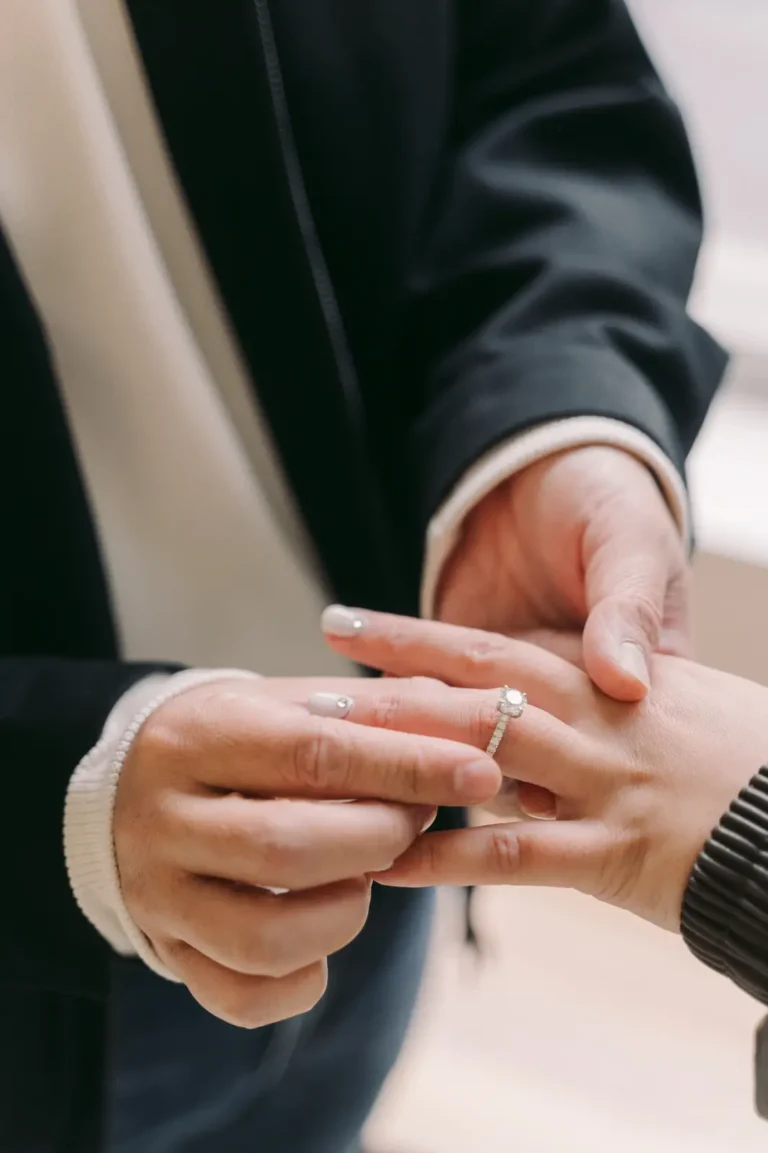 Close-up of an engagement ring being placed after a romantic Seoul proposal