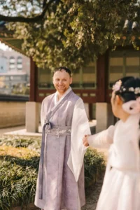Couple smiling during a traditional hanbok photoshoot at Gyeongbokgung